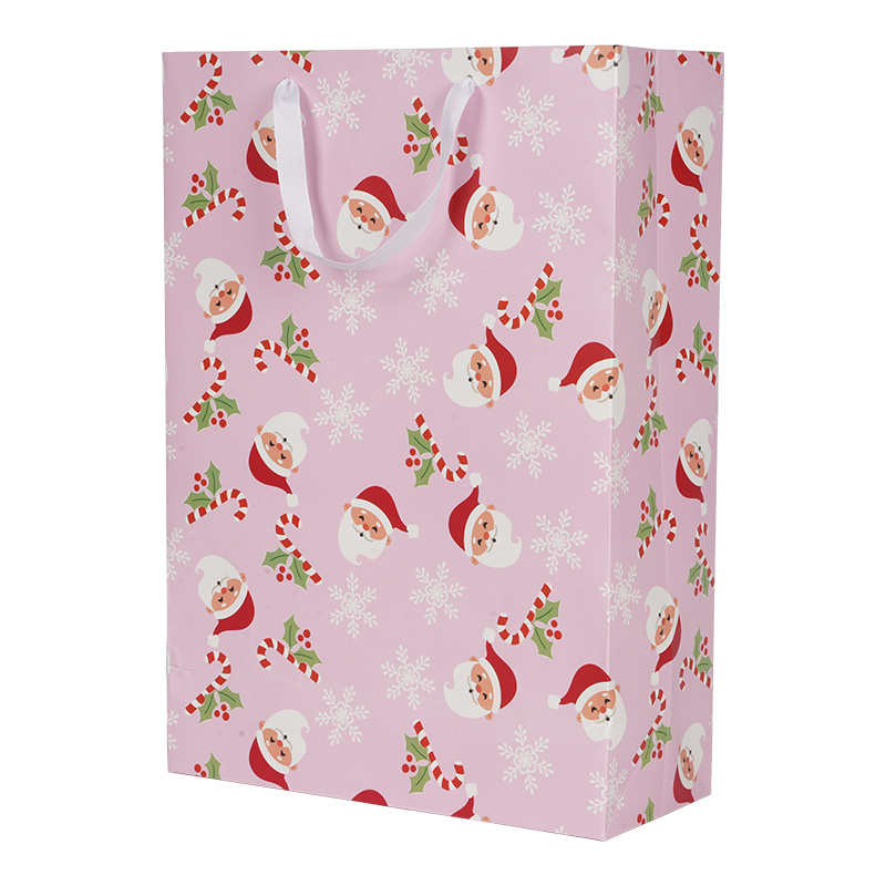 حقيبة ورقية وردية اللون لعيد الميلاد بمقبض لهدايا العطلات